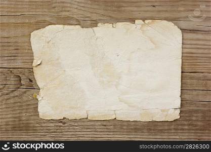 vintage paper page on old wooden boards