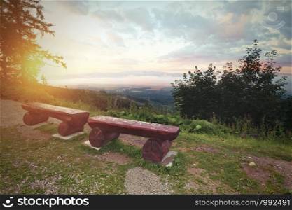 Vintage photo of bench at the mountains