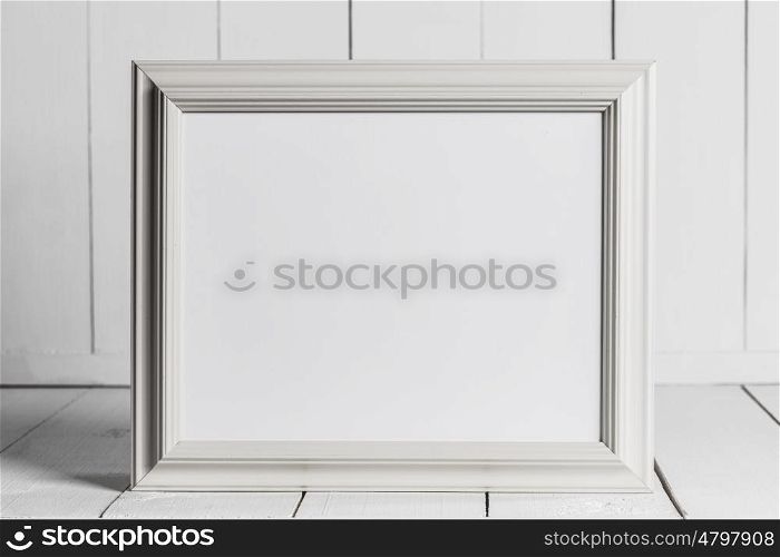 Vintage picture frame. Vintage white wooden picture frame with blank white copy space