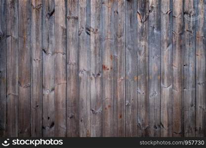 Vintage pine wooden wall with random texture background, vignette effect.