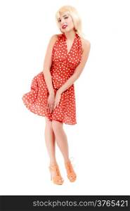 Vintage pinup style. Full length of beautiful stylized young woman. Attractive girl in blond wig and retro spotted red dress isolated on white. Disguise. Studio shot.