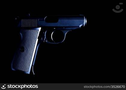 vintage pistol on black background