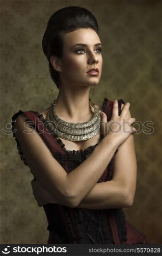 vintage portrait of beautiful young woman in elegant old fashion purple dress , important necklace looking on one side