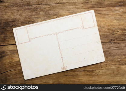 Vintage postcard on wooden table