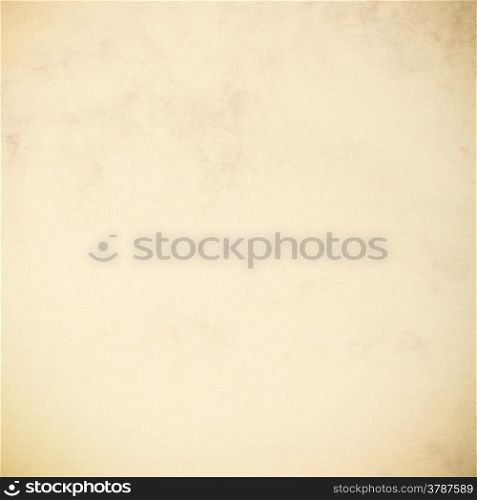 Vintage poster paper texture with a glowing center and grunge vignette abstract background