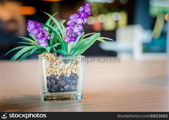 Vintage purple flowers on the table in a restaurant.