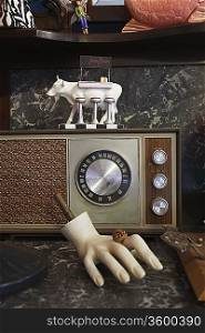 Vintage Radio and Mannequin Hand in Second Hand Store