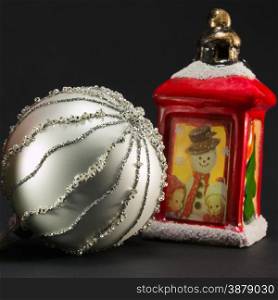 vintage red lantern with snowman and children picture and bright christmas ball