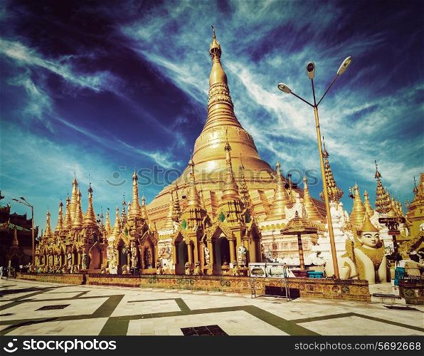 Vintage retro effect filtered hipster style image of Myanmer famous sacred place and tourist attraction landmark - Shwedagon Paya pagoda. Yangon, Myanmar