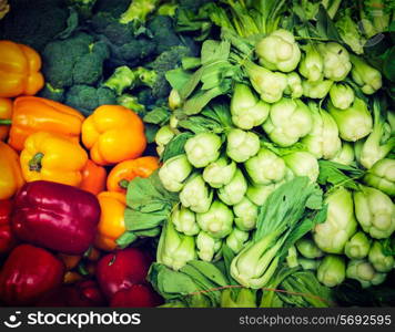Vintage retro effect filtered hipster style image of Vegetables in Asian market close up - Capsicum bell peppers, broccoli cabbage, Green chinese cabbage