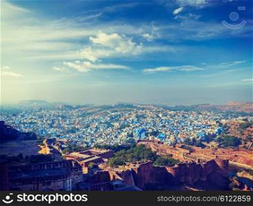 Vintage retro effect filtered hipster style panorama image of Jodhpur, known as Blue City due to blue-painted Brahmin houses. View from Mehrangarh Fort. Rajasthan, India