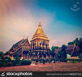 Vintage retro effect filtered hipster style travel image of Buddhist temple Wat Chedi Luang in twilight. Chiang Mai, Thailand