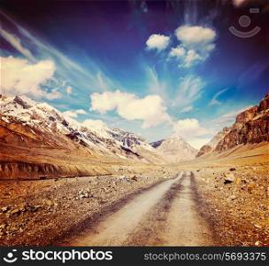 Vintage retro effect filtered hipster style travel image of Road in mountains Himalayas. Spiti Valley, Himachal Pradesh, India