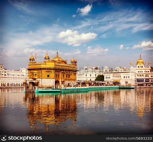 Vintage retro effect filtered hipster style travel image of Sikh gurdwara Golden Temple (Harmandir Sahib). Amritsar, Punjab, India