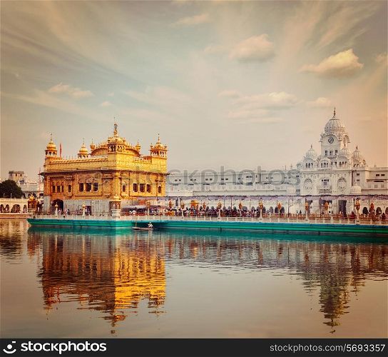 Vintage retro effect filtered hipster style travel image of Sikh gurdwara Golden Temple Harmandir Sahib. Amritsar, Punjab, India