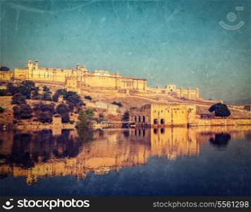 Vintage retro hipster style image of Famous Rajasthan landmark - Amer (Amber) fort, Rajasthan, India with grunge texture overlaid