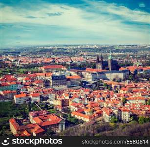 Vintage retro hipster style travel image of aerial view of Hradchany part of Prague: the Saint Vitus (St. Vitt&#39;s) Cathedral and Prague Castle, view from Petrin Observation Tower. Prague, Czech Republic