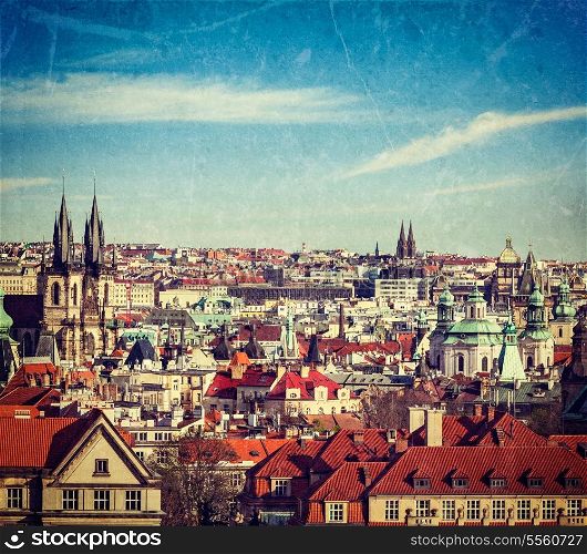 Vintage retro hipster style travel image of aerial view of Prague, Czech Republic with grunge texture overlaid