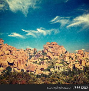 Vintage retro hipster style travel image of Ancient ruins of Hampi. Karnataka, India with grunge texture overlaid