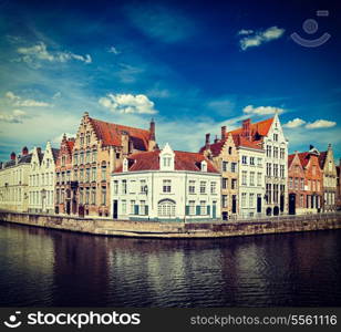 Vintage retro hipster style travel image of Benelux travel concept background - Bruges canal and medieval houses. Brugge, Belgium