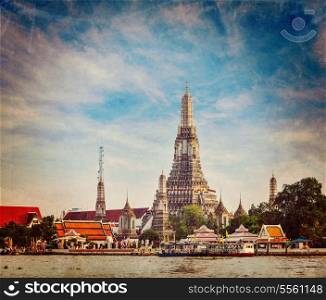 Vintage retro hipster style travel image of Buddhist temple (wat) Wat Arun on Chao Phraya River with grunge texture overlaid. Bangkok, Thailand