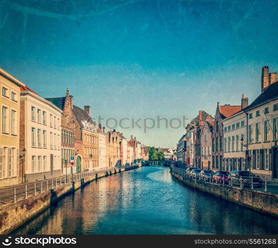 Vintage retro hipster style travel image of canal and medieval houses. Bruges (Brugge), Belgium with grunge texture overlaid