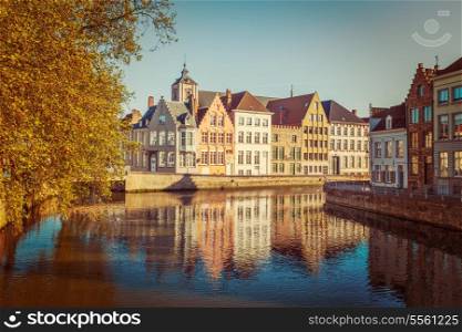 Vintage retro hipster style travel image of canal and medieval houses. Bruges (Brugge), Belgium