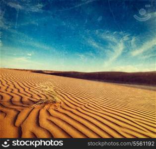 Vintage retro hipster style travel image of dunes of Thar Desert. Sam Sand dunes, Rajasthan, India with grunge texture overlaid