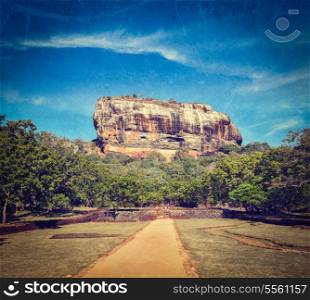 Vintage retro hipster style travel image of famous ancient Sigiriya rock with grunge texture overlaid. Sri Lanka