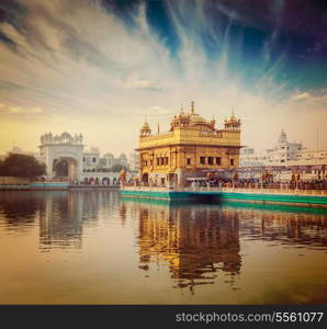 Vintage retro hipster style travel image of famous India attraction Sikh gurdwara Golden Temple (Harmandir Sahib). Amritsar, Punjab, India