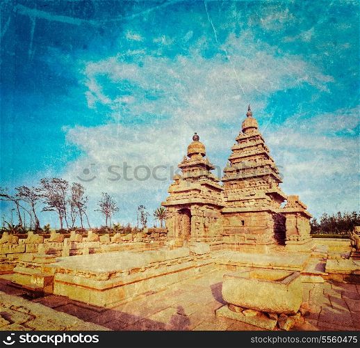 Vintage retro hipster style travel image of famous Tamil Nadu landmark - Shore temple, world heritage site in Mahabalipuram, Tamil Nadu, India with grunge texture overlaid