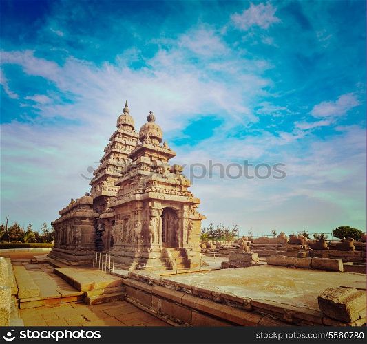 Vintage retro hipster style travel image of famous Tamil Nadu landmark - Shore temple, world heritage site in Mahabalipuram, Tamil Nadu, India