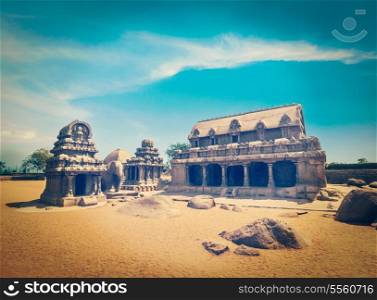 Vintage retro hipster style travel image of Five Rathas - ancient Hindu monolithic Indian rock-cut architecture. Mahabalipuram, Tamil Nadu, South India