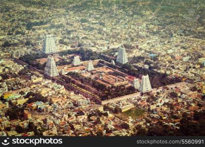 Vintage retro hipster style travel image of Hindu temple and indian city aerial view with grunge texture overlaid. Arulmigu Arunachaleswarar Temple, Tiruvannamalai, Tamil Nadu, India