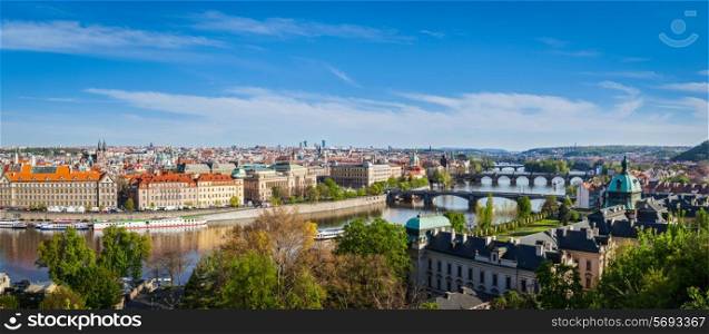 Vintage retro hipster style travel image of panoramic view of bridges over Vltava river from Letna Park. Prague, Czech Republic. Stitched panorama