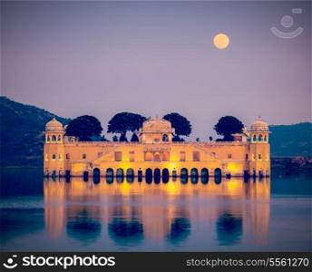 Vintage retro hipster style travel image of Rajasthan landmark - Jal Mahal (Water Palace) on Man Sagar Lake in the evening in twilight. Jaipur, Rajasthan, India
