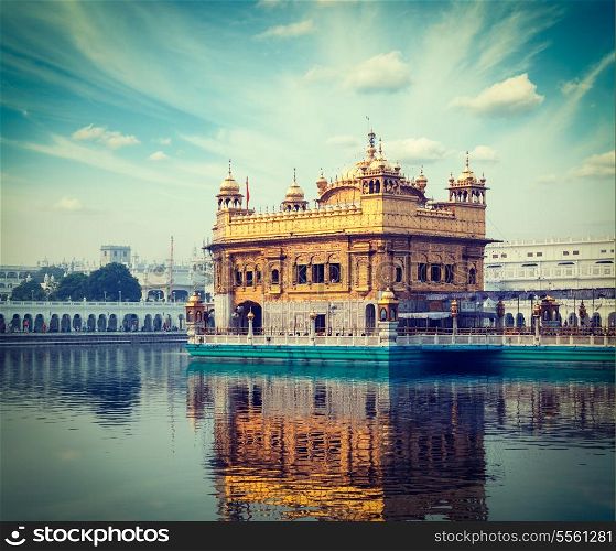 Vintage retro hipster style travel image of Sikh gurdwara Golden Temple (Harmandir Sahib). Amritsar, Punjab, India