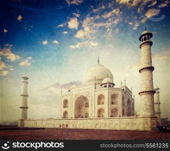 Vintage retro hipster style travel image of Taj Mahal on sunrise. Indian Symbol - India travel background with grunge texture overlaid. Agra, India
