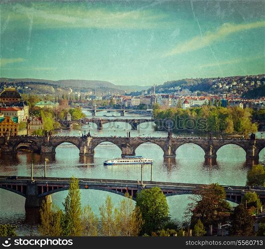 Vintage retro hipster style travel image of travel Prague concept background - elevated view of bridges over Vltava river from Letna Park. Prague, Czech Republic with grunge texture overlaid