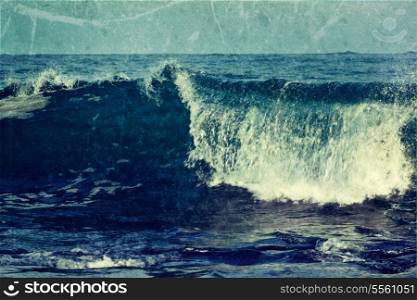 Vintage retro hipster style travel image of wave close up in ocean with grunge texture overlaid. Sri Lanka