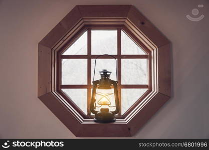 Vintage retro style metal lantern on the window