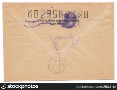 "Vintage russian envelope with meter stamps, old yellowed paper, isolated on white. Russian inscription: "Attention! Sample of filling zip-code""