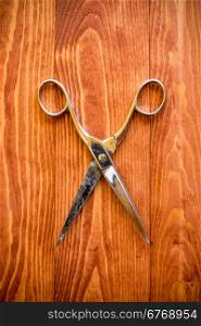 Vintage scissors on a wooden work table