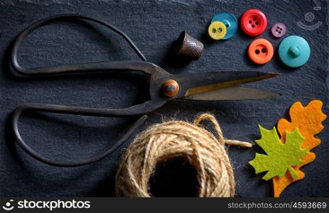 vintage scissors with a roll of twine and buttons