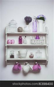 Vintage shelf in the kitchen, shabby chic style with lavender. Vintage shelf on wall