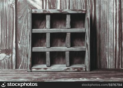 Vintage shelf stand on the wooden background. The vintage shelf