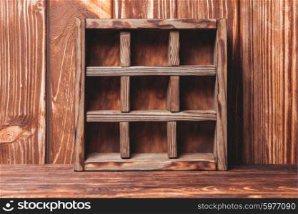Vintage shelf stand on the wooden background. Vintage shelf