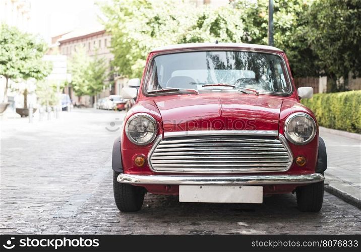 Vintage small red car on the street