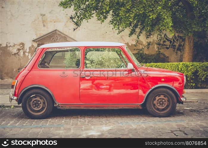 Vintage small red car on the street