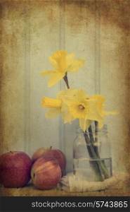 Vintage still life of Spring flowers with aged texture filter effect applied